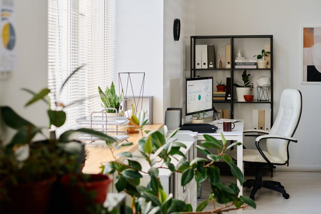 Organized desk workspace inside a second bedroom apartment home office.